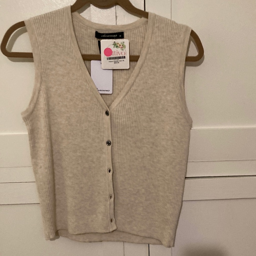 Olivaeous button cream vest, size M.